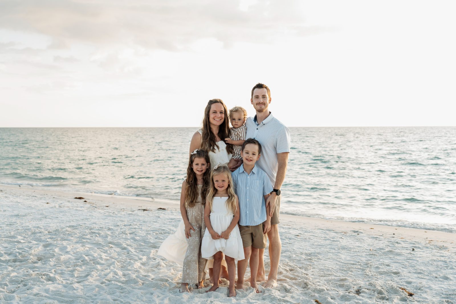 Matthew Osborn with his wife Joy and their children on the beach